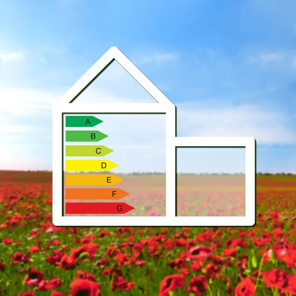 House with the sign of energy saving on a background field with — Stock Photo, Image