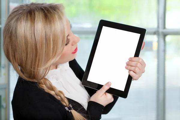 Beautiful woman in the office holding a tablet with isolated scr — Stock Photo, Image