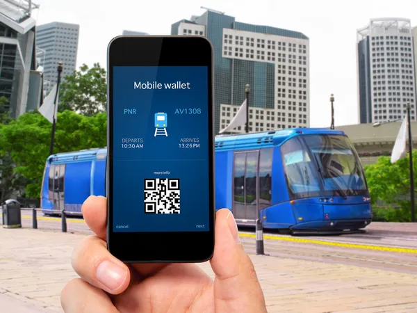 Man hand holding the phone with a mobile wallet and train ticket — Stock Photo, Image