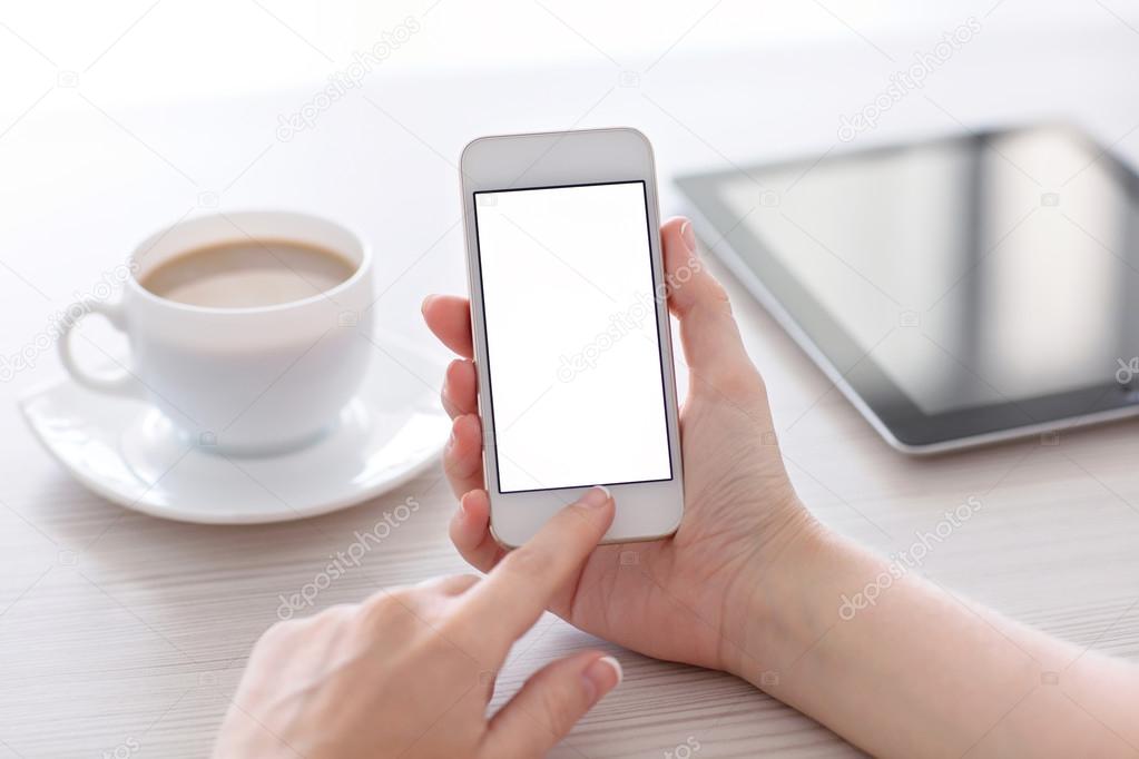 Women hands holding the white phone with isolated screen above t