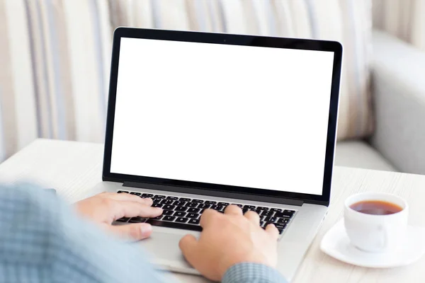 Man typing on a laptop keyboard in the room — Stock Photo, Image