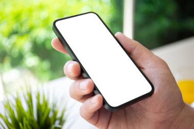 man hand holding phone with isolated screen in caf