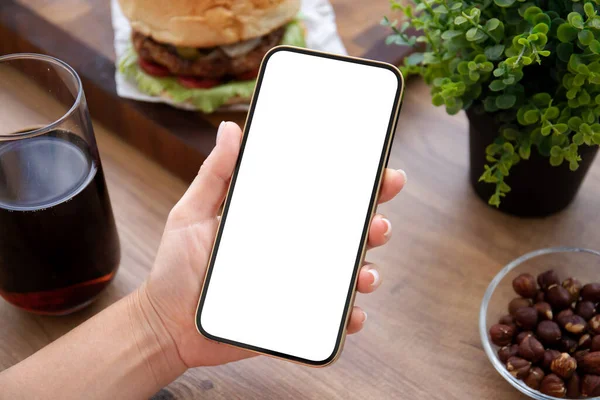 Female Hand Holding Phone Isolated Screen Background Burger Cafe — Stock Photo, Image