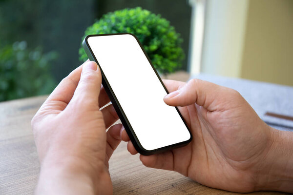man hands hold phone with isolated screen background of table in cafe