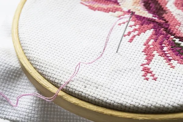 Pink embroidery on hoop