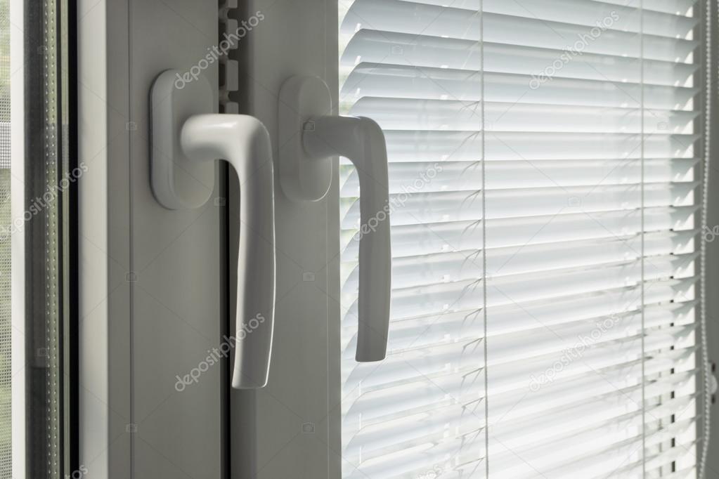 Closed blinds and window handles