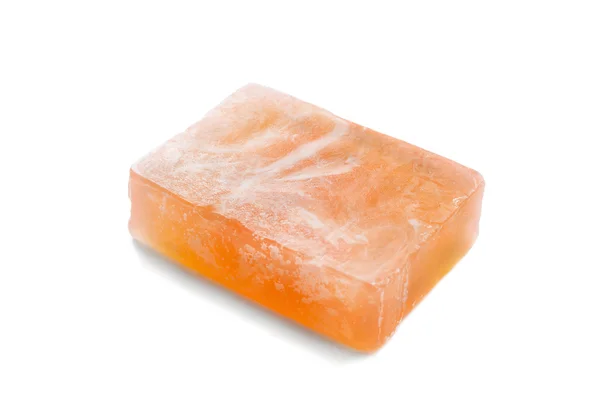 Кусок оранжевого мыла — стоковое фото