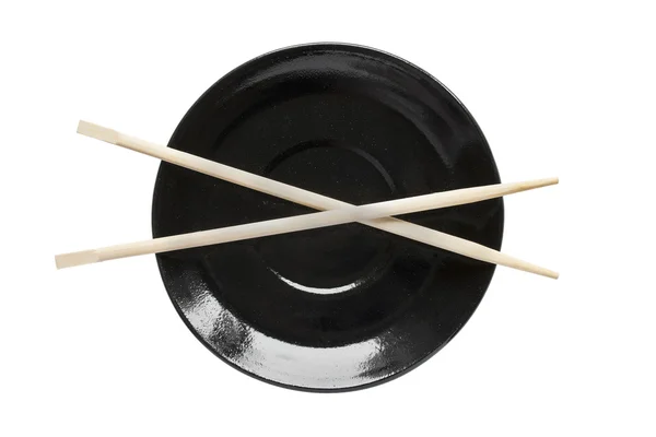 Chopsticks on a plate — Stock Photo, Image