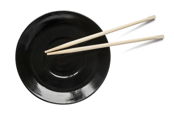 Chopsticks on a plate — Stock Photo, Image