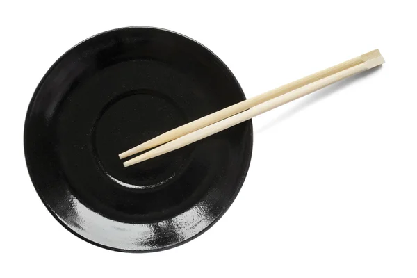 Chopsticks on a plate — Stock Photo, Image