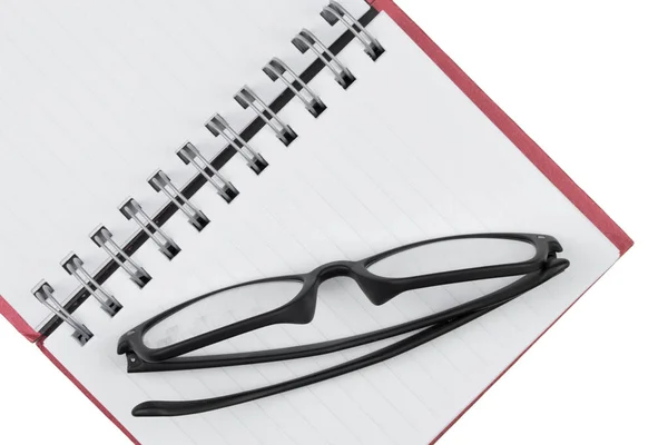 Lunettes Place Sur Carnet Ouvert Isolé Sur Fond Blanc Photo De Stock