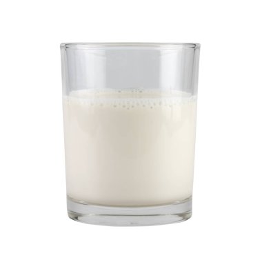 hot milk in grass isolated on white background