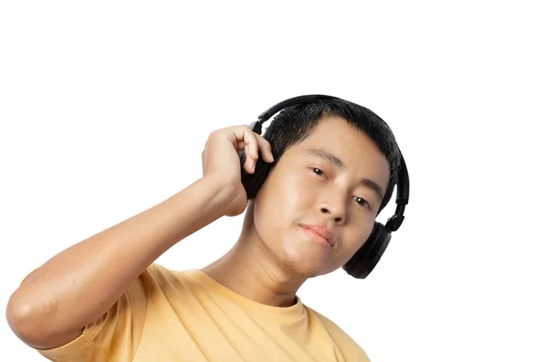 Молодий Чоловік Слухає Музику Навушниками Ізольовано Білому Тлі Відсічні Контури — стокове фото