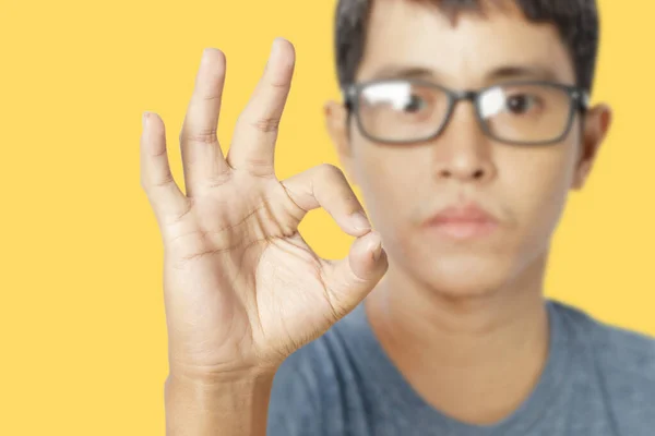 Young Man Showing Sign Isolated Yellow Background Clipping Paths — Stock fotografie