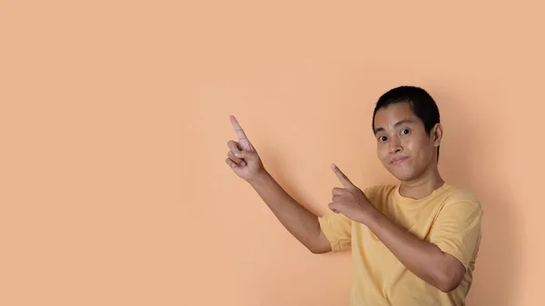 Young Man Pointing His Finger Isolated Orange Studio Background Copy — Stockfoto
