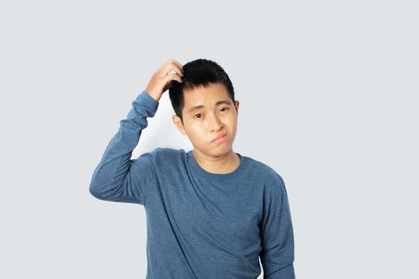 Retrato Jovem Vestindo Camiseta Sentindo Desapontado Isolado Fundo Cinza Com — Fotografia de Stock