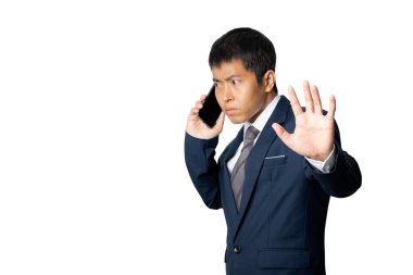 Portrait of businessman using smartphone show stop gesture sign by hand. Human emotion face expression concept. Studio shot isolated on white background. copy space.