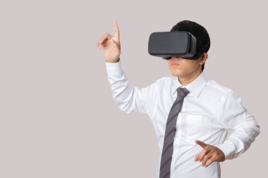 Studio portrait man wearing VR Headset isolated on gray background. Glasses of virtual reality. Technology, gaming, entertainment and people concept. copy space.