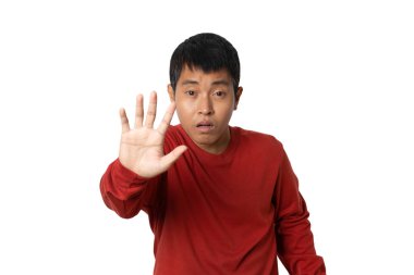 Portrait of young man show stop gesture sign by hand, hands show refusal gesture. Human emotion face expression concept. Studio shot isolated on white background. copy space