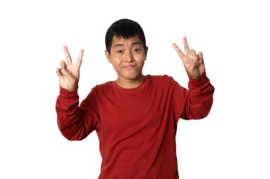 Portrait of young man show gesture victory sign hand, Human emotion face expression concept. Studio shot isolated on white background. copy space