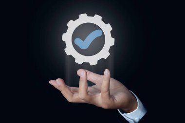 Businessman hand shows sign top service Quality assurance, ISO certification, Assurance and standardization concept.