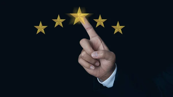 Businessman hand giving five star rating. Service rating, satisfaction concept. Customer evaluation feedback excellent service and best customer experience. Service rating very impressed.