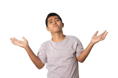 Portrait of young man showing I don't know gesture, making no idea gesture. Human emotion face expression concept. Studio shot isolated on white background. copy space.