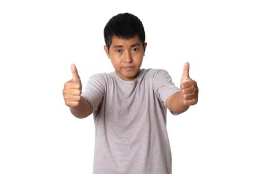 Portrait of young asian man showing approving doing positive gesture with hand for success. winner gesture. Human emotion face expression concept. Studio shot isolated on white background. copy space.