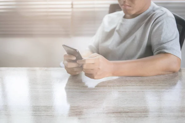 Man using smartphone. Social media interactions on mobile phone, person hands holding smartphone and touch sceen on mobile.