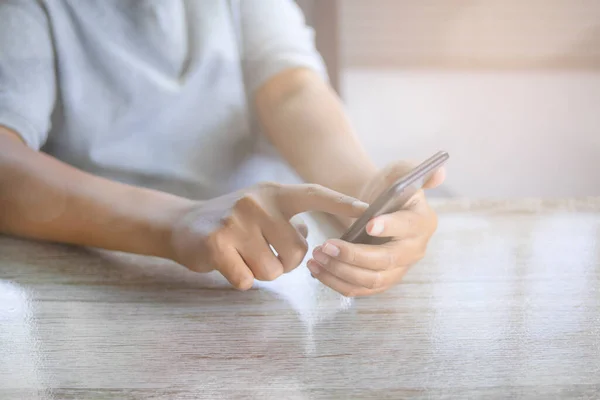 Man using smartphone. Social media interactions on mobile phone, person hands holding smartphone and touch sceen on mobile.