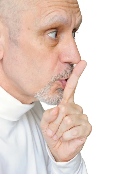 Senior homem instigando silêncio — Fotografia de Stock