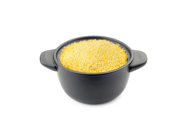 Polenta in einer schwarzen Tasse — Stockfoto