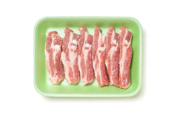 Costillas de cerdo en bandeja de espuma — Foto de Stock