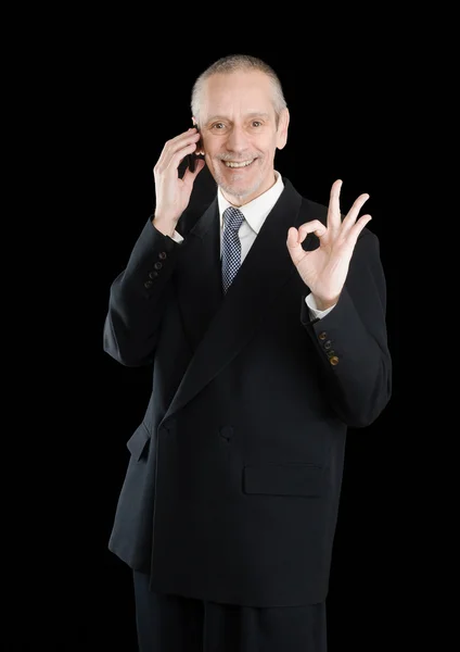 Lachende oke zakenman op telefoon — Stockfoto