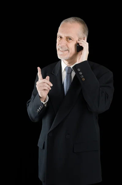 Liebenswerter und lächelnder Geschäftsmann am Telefon — Stockfoto