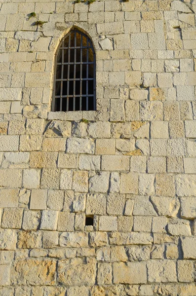 Window in the wall of the old tower — Stock Photo, Image