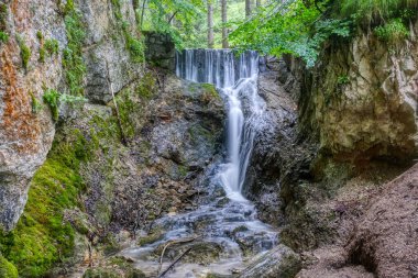 Romantic Lainbach waterfall  and creek in the mountains near Mittenwald