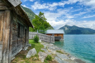 Old houses on the shoreline of lake Walchensee