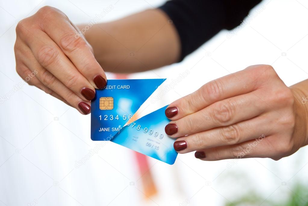 woman hand holding cut credit card