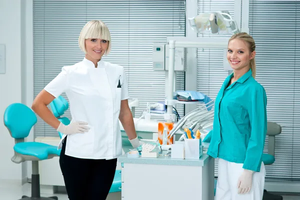 Woman dentist with assistant Royalty Free Stock Images