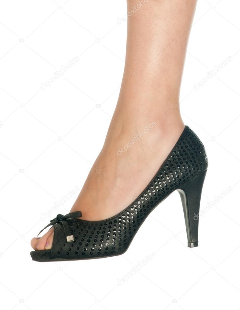woman feet in black shoe