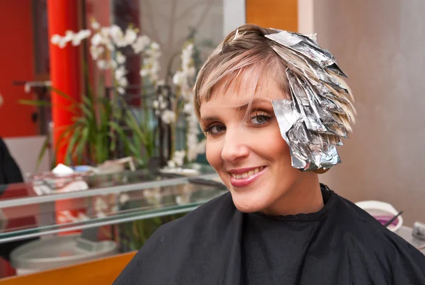 Woman with coloring foil — Stock Photo, Image