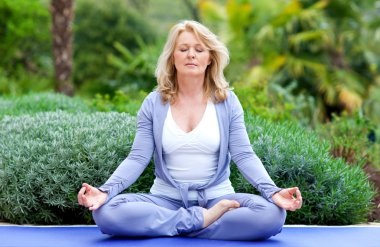 mature woman in yoga position