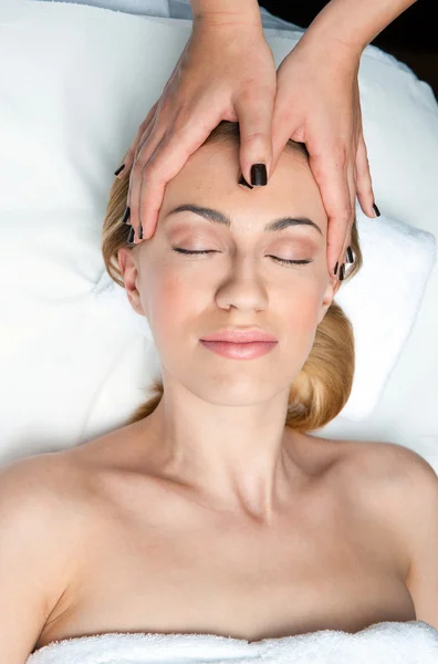 Woman on head massage in wellness Royalty Free Stock Images