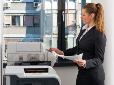 business woman working on printer clipart