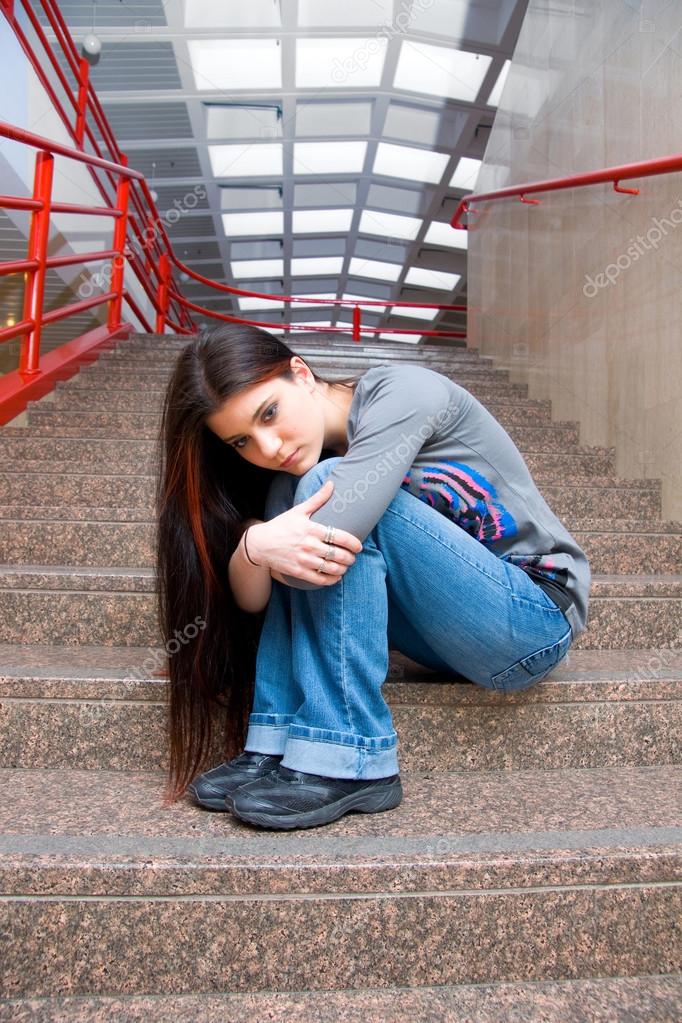 Sad teen girl on school stairs Stock Photo by ©bertys30 25982453