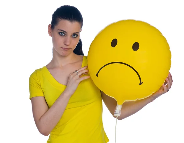 Teen girl with sad smiley balloon — Stock Photo, Image