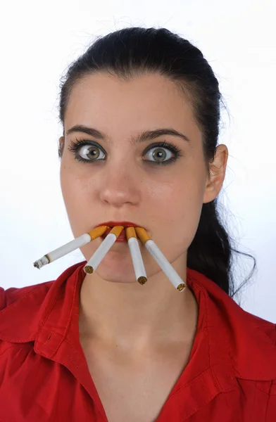 Woman smoking four cigarettes — Stock Photo, Image