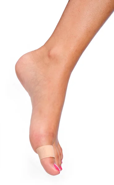 Woman foot with patch — Stock Photo, Image