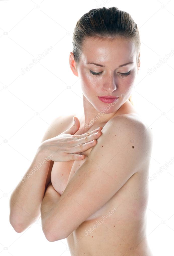 woman looking mall on her skin